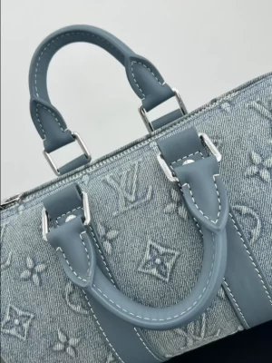 LOUIS VUITTON BANDOULIÈRE KEEPALL 25 - WLM561